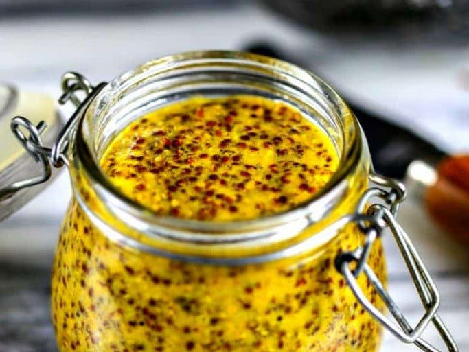 Old-style whole-grain mustard in a swing-top glass jar