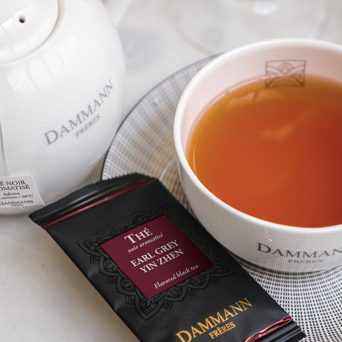 Dammann Frères Earl Grey Yin Zhen sachet with a cup of tea