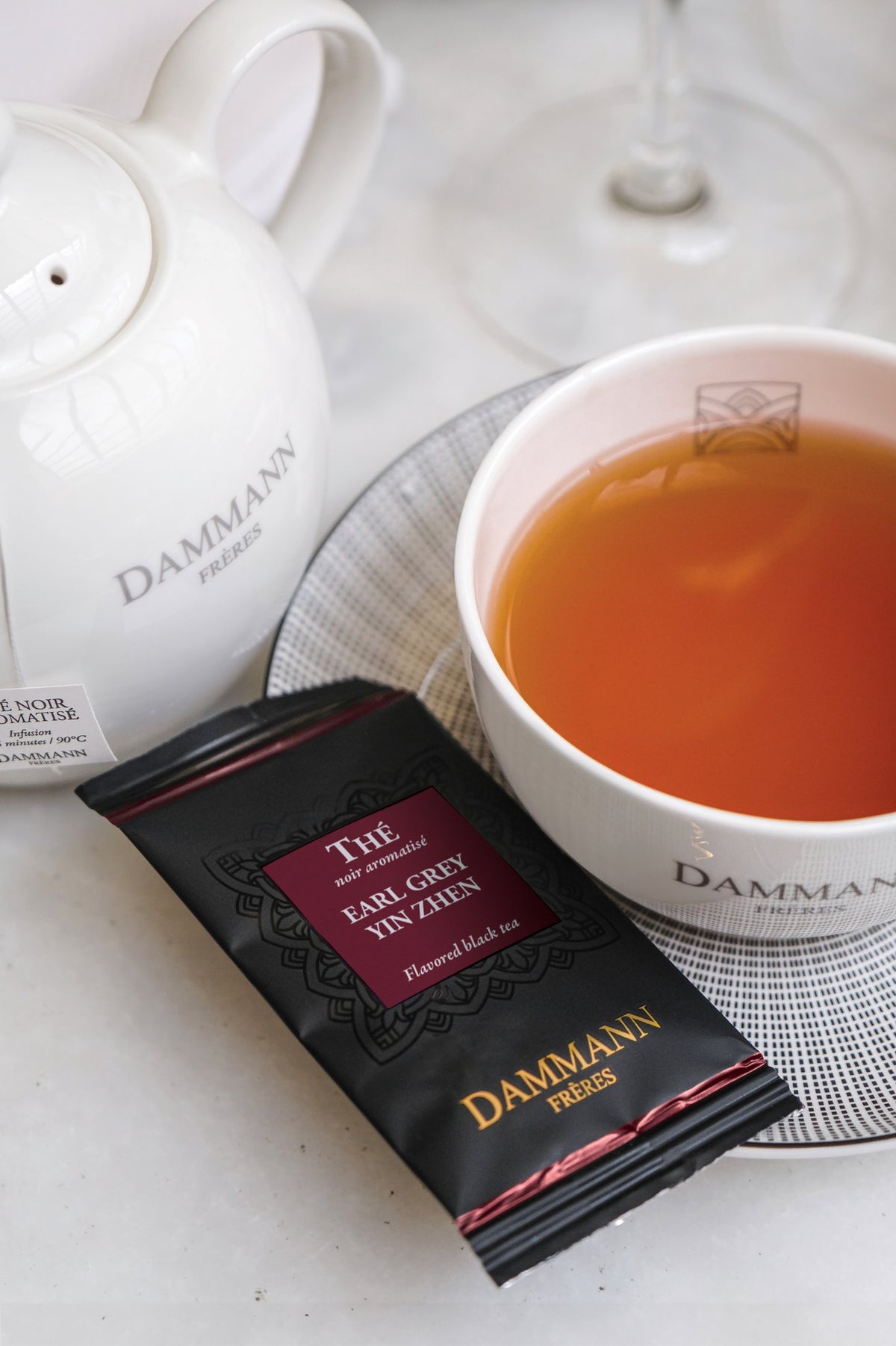Dammann Frères Earl Grey Yin Zhen sachet with a cup of tea