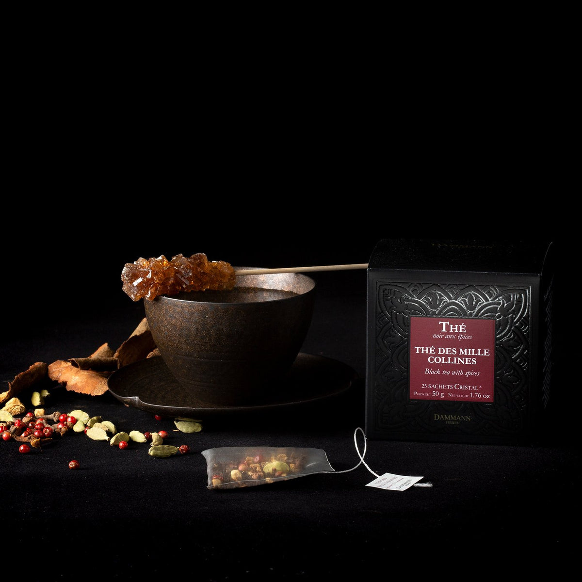 Dammann Frères Mille Collines tea sachet with loose leaves and a cup