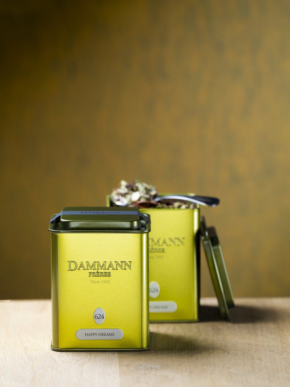 Dammann Frères Happy Dreams canisters on a wooden table