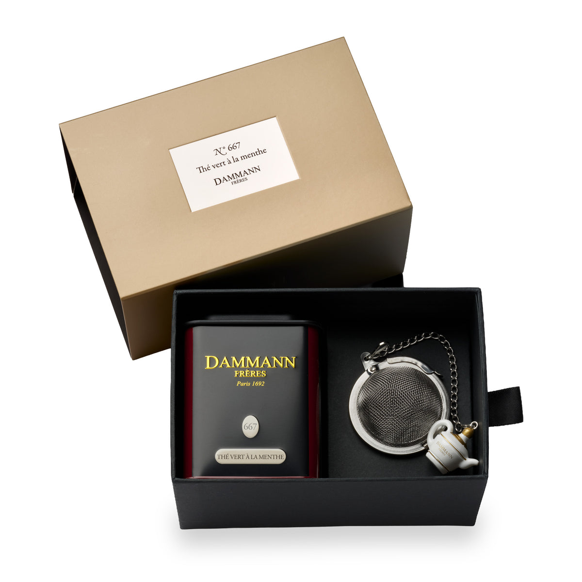 N°667 Thé vert à la menthe gift box by Dammann Frères, open with a tea tin and a tea ball infuser