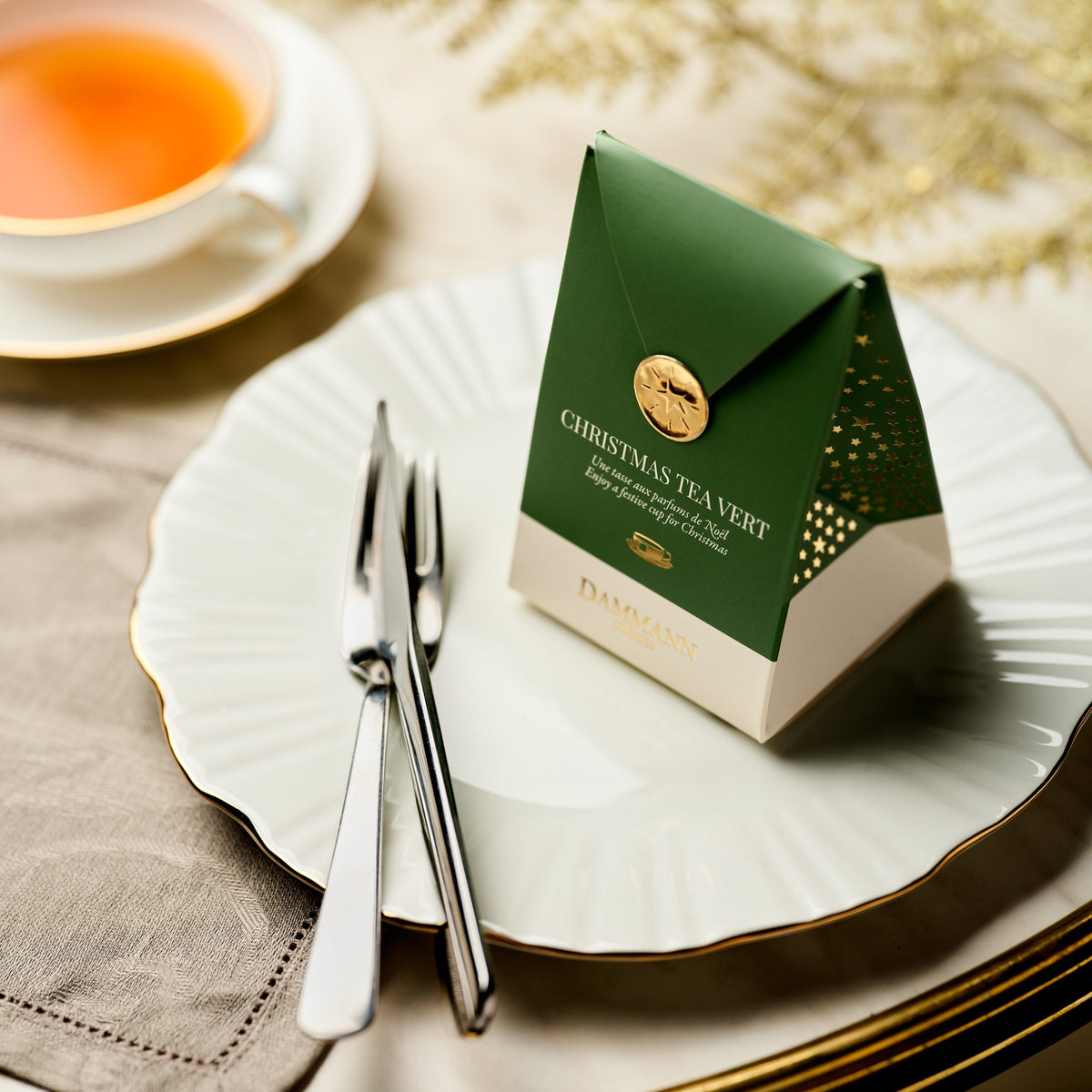 Dammann Frères Christmas Tea Vert pocket on a festive table setting