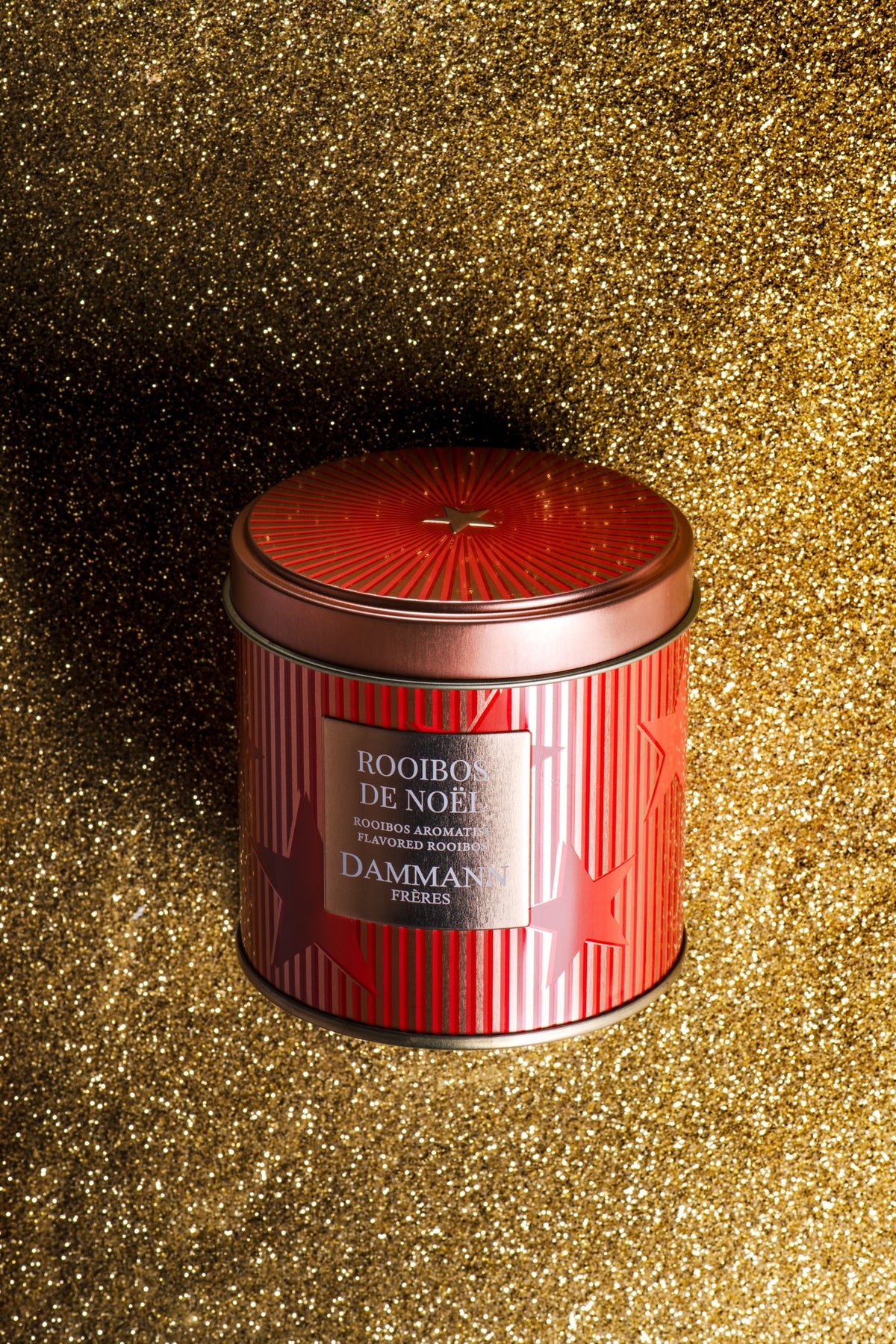 Rooibos de Noël canister by Dammann Frères, red striped tin on gold glitter