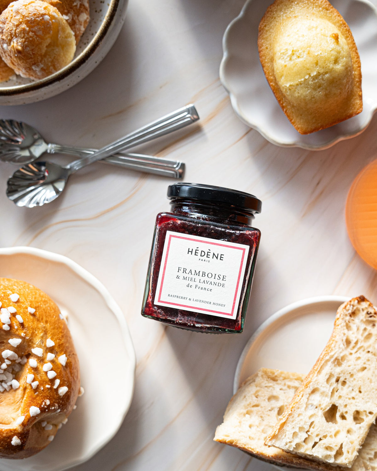 Hédène raspberry jam with lavender honey among brioches and pastries