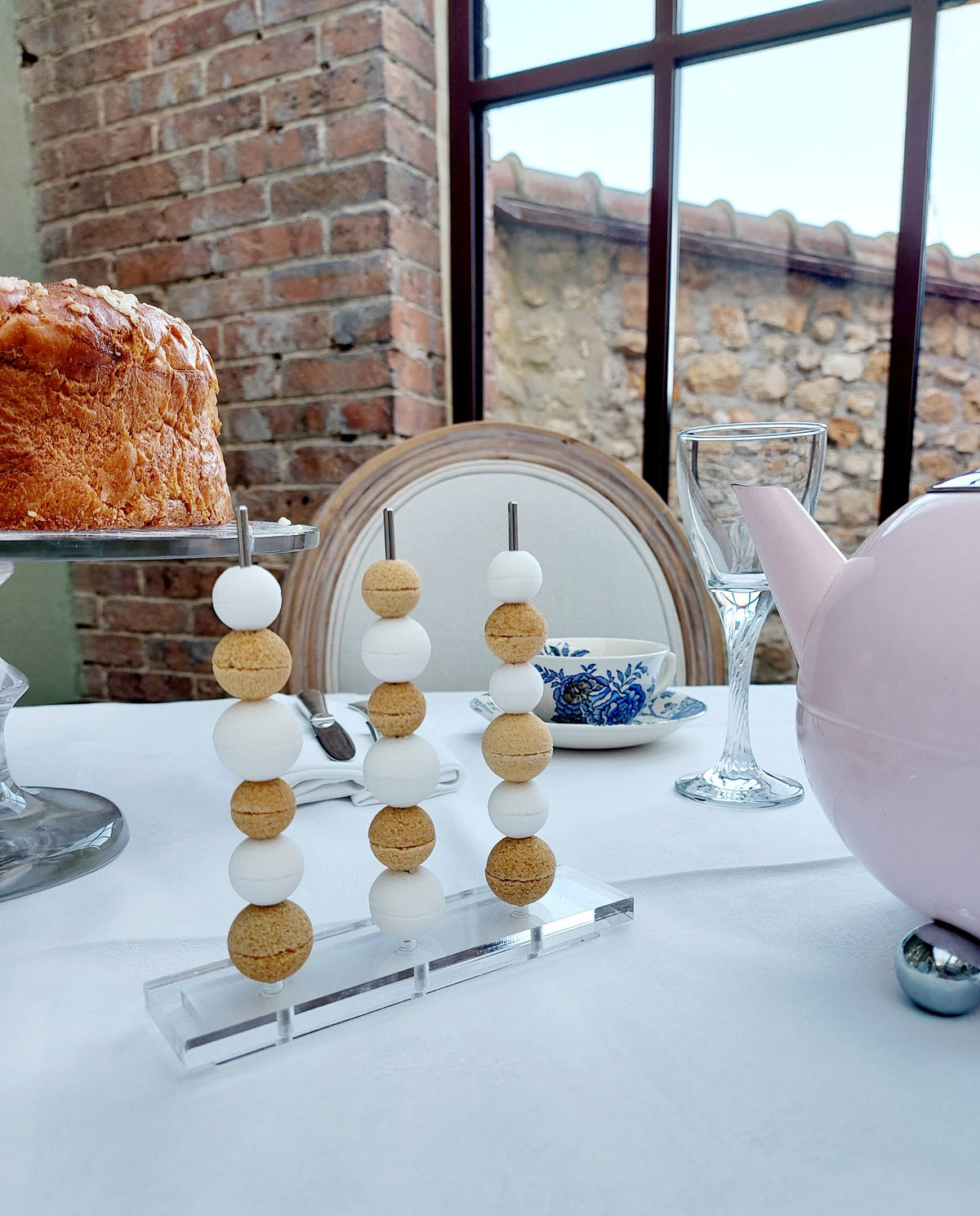Canasuc Le Boulier sugar beads on sticks beside a cup