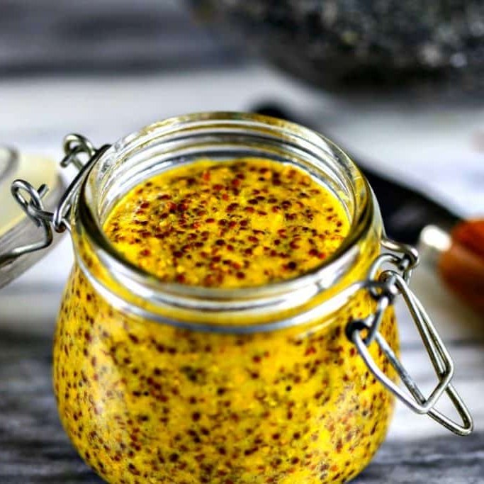 Old-style whole-grain mustard in a swing-top glass jar