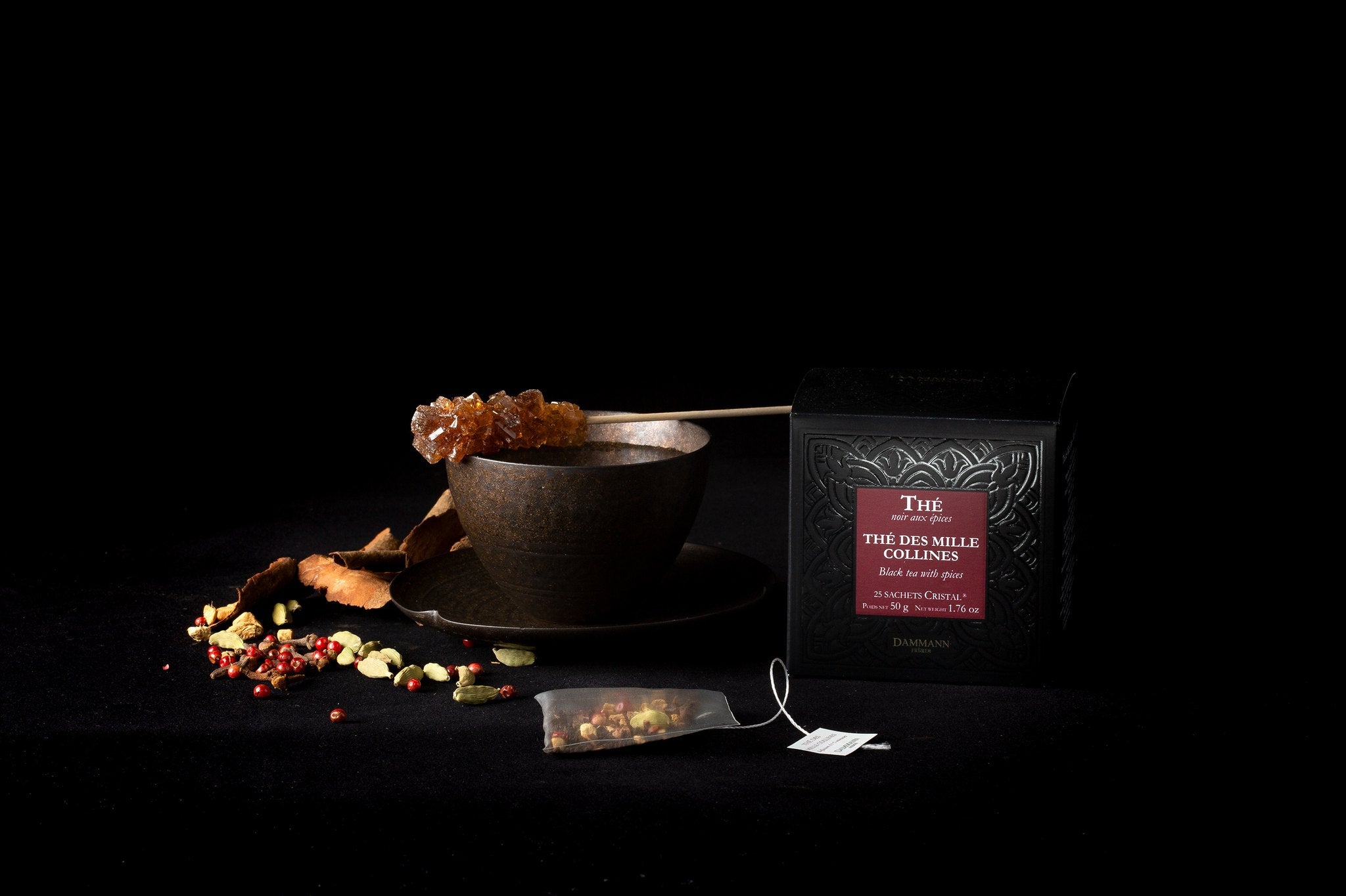 Dammann Frères Mille Collines tea sachet with loose leaves and a cup
