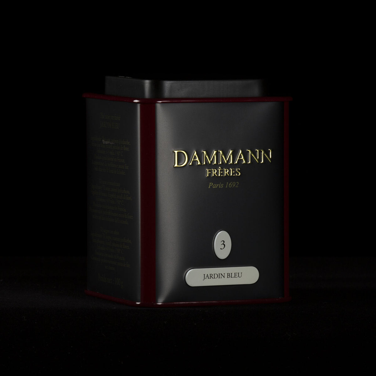 Dammann Frères Jardin Bleu canister on a black background