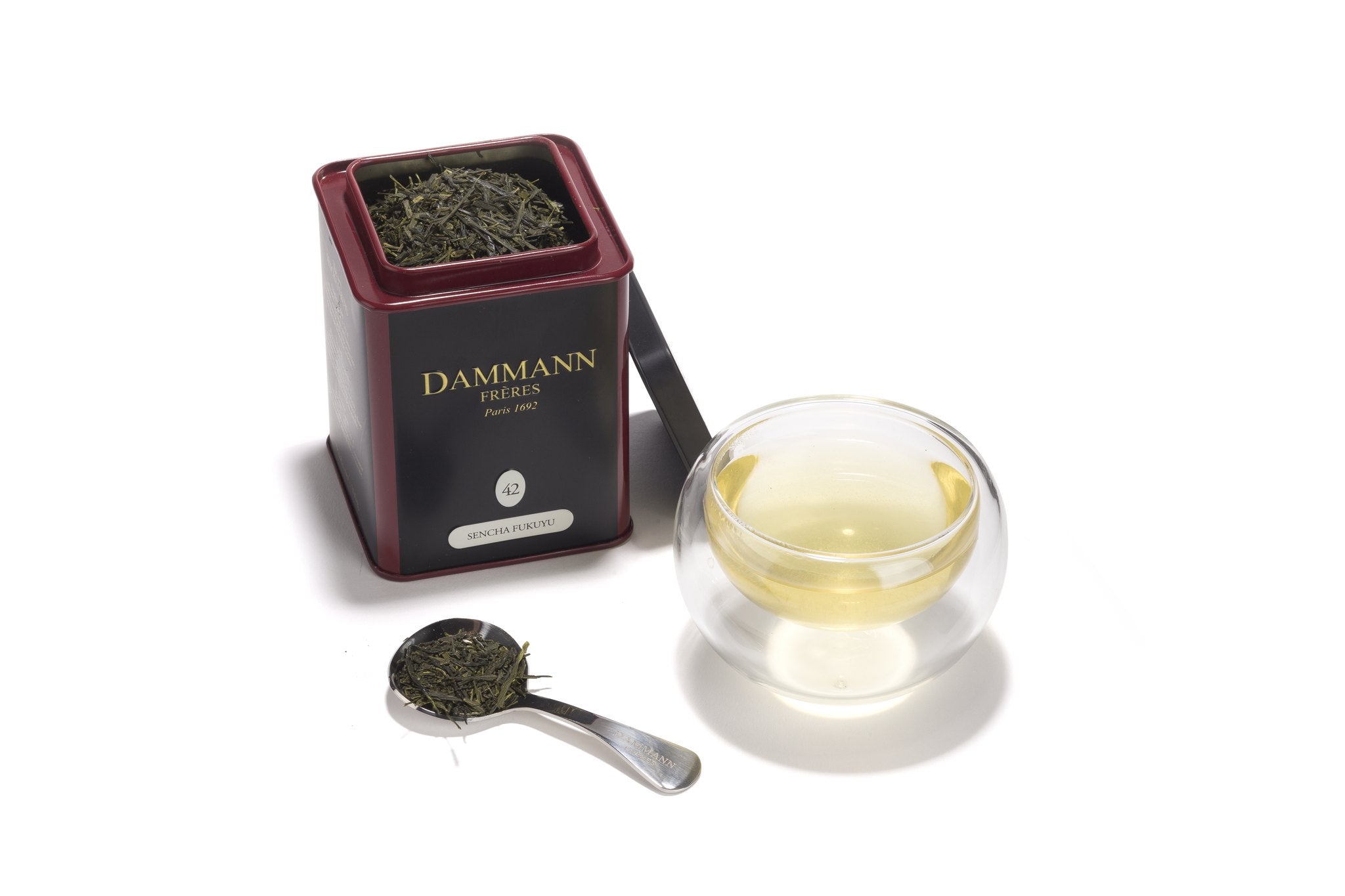 Dammann Frères Sencha Fukuyu canister with a glass of green tea
