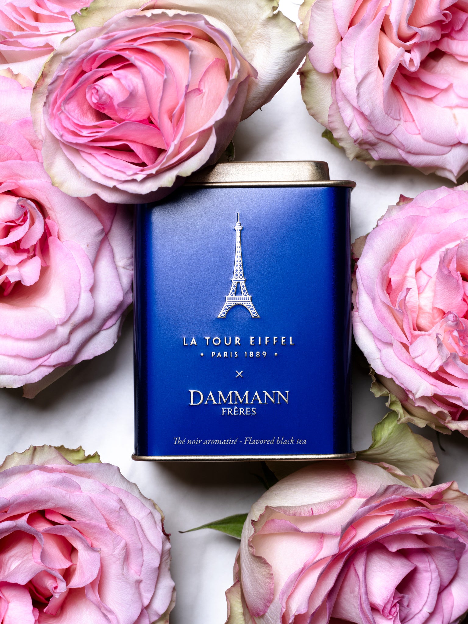 Tour Eiffel Tea tin by Dammann Frères among pink roses
