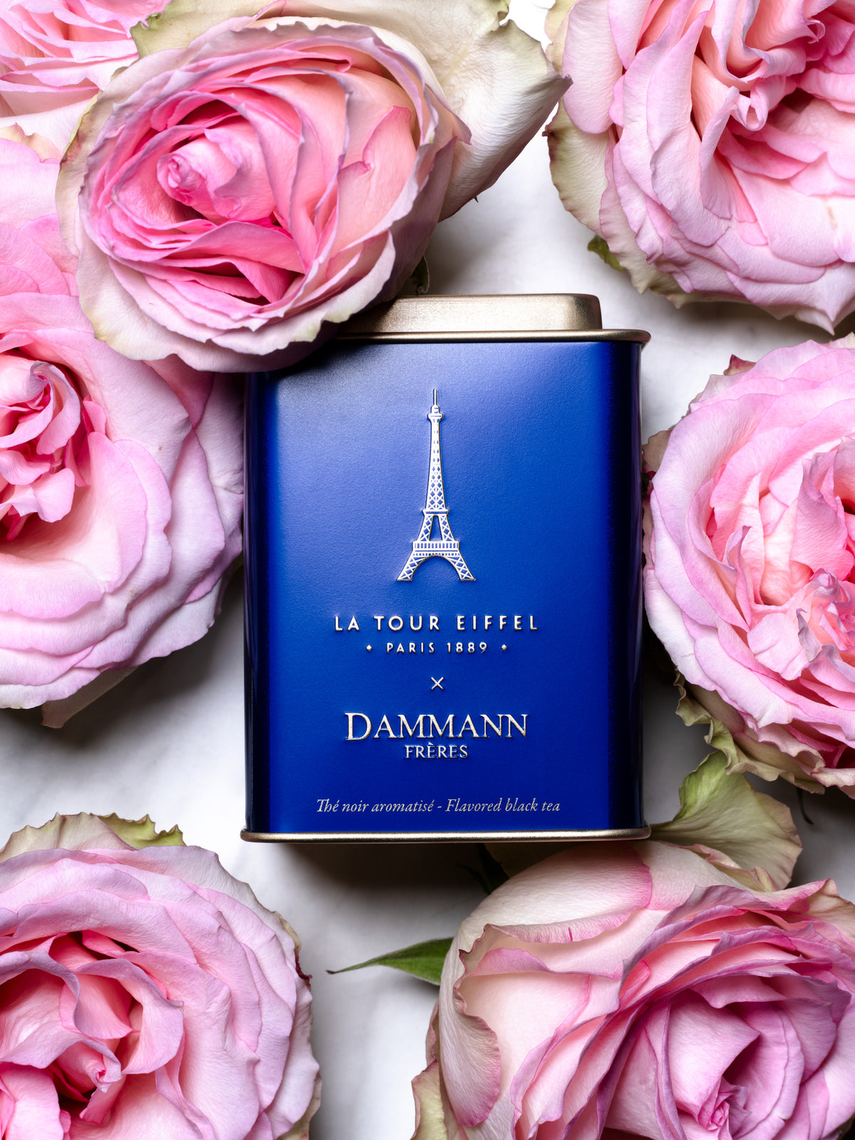 Tour Eiffel Tea tin by Dammann Frères among pink roses