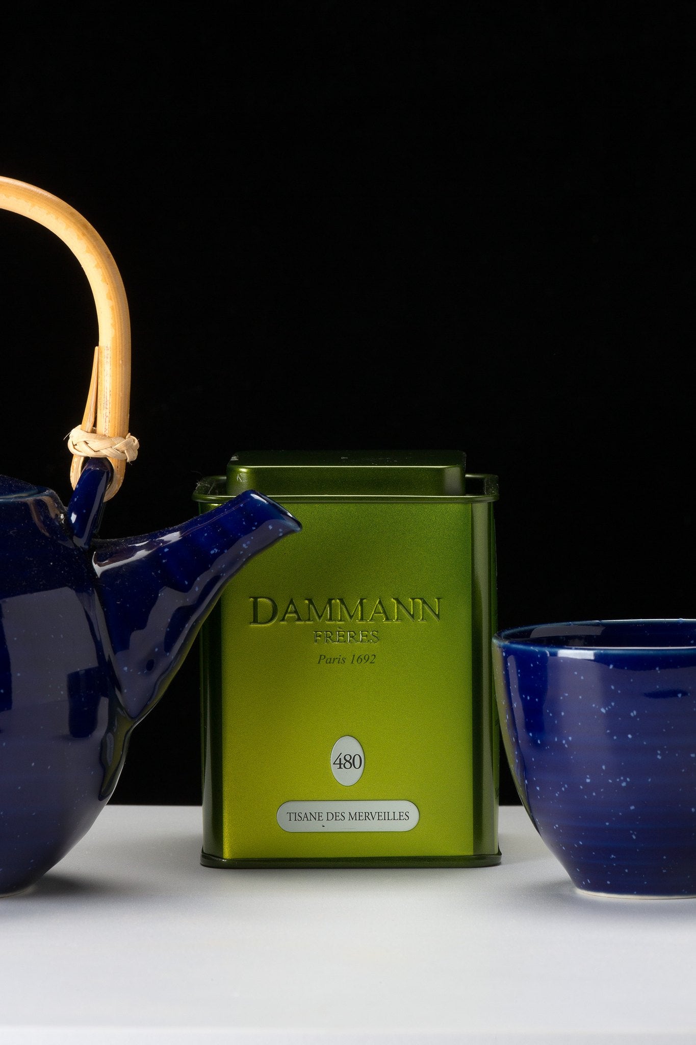 Dammann Frères Tisane des Merveilles canister with a blue teapot and bowl