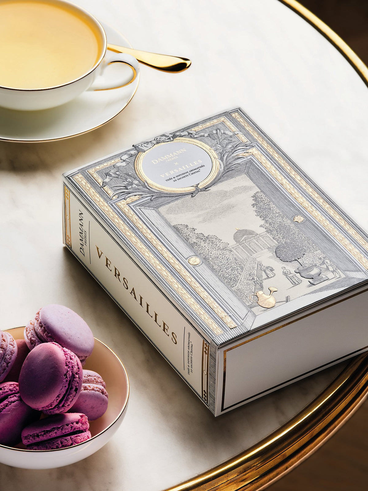 Dammann Frères Versailles tea gift box with macarons and a cup of tea