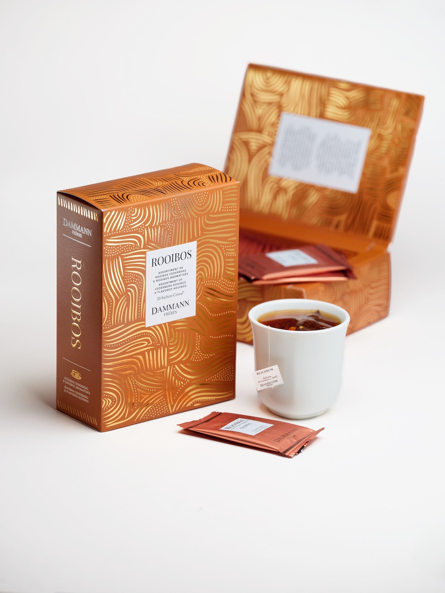 Rooibos Gift Box by Dammann Frères with tea sachets and a cup of rooibos