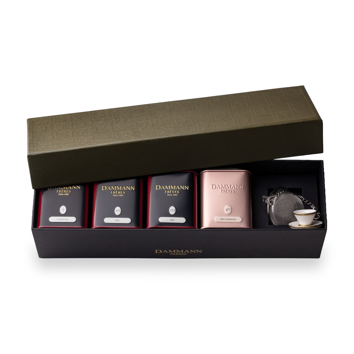 Jardin Exotique Gift Set by Dammann Frères, open dark green box with four tea tins and a tea ball infuser