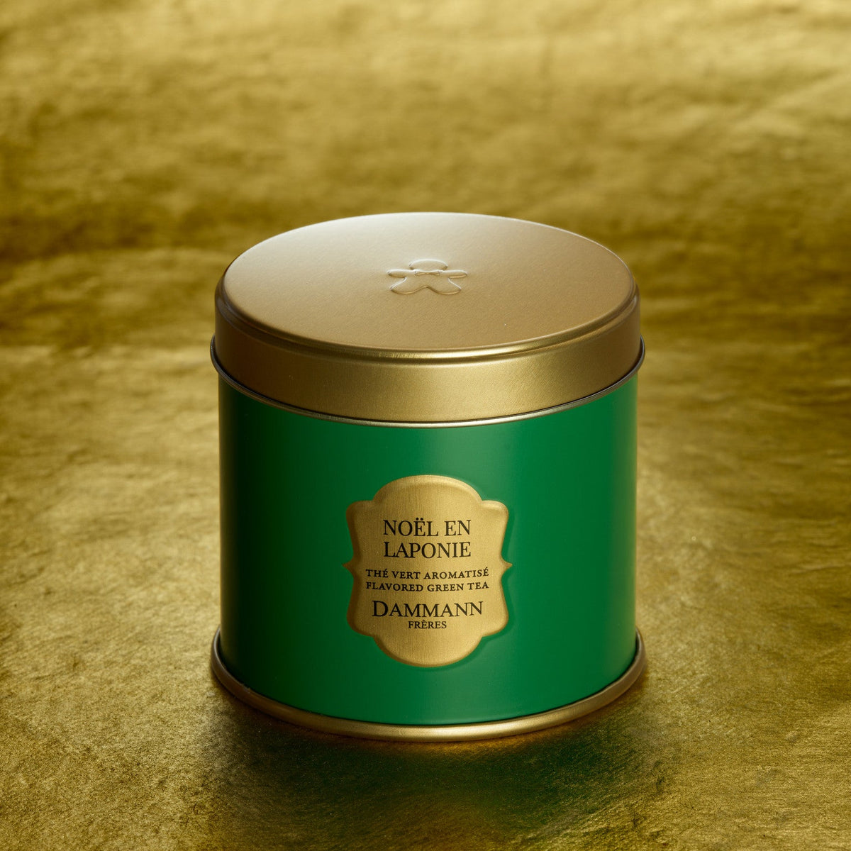 Noël en Laponie by Dammann Frères, evergreen and gold tin on a gold background