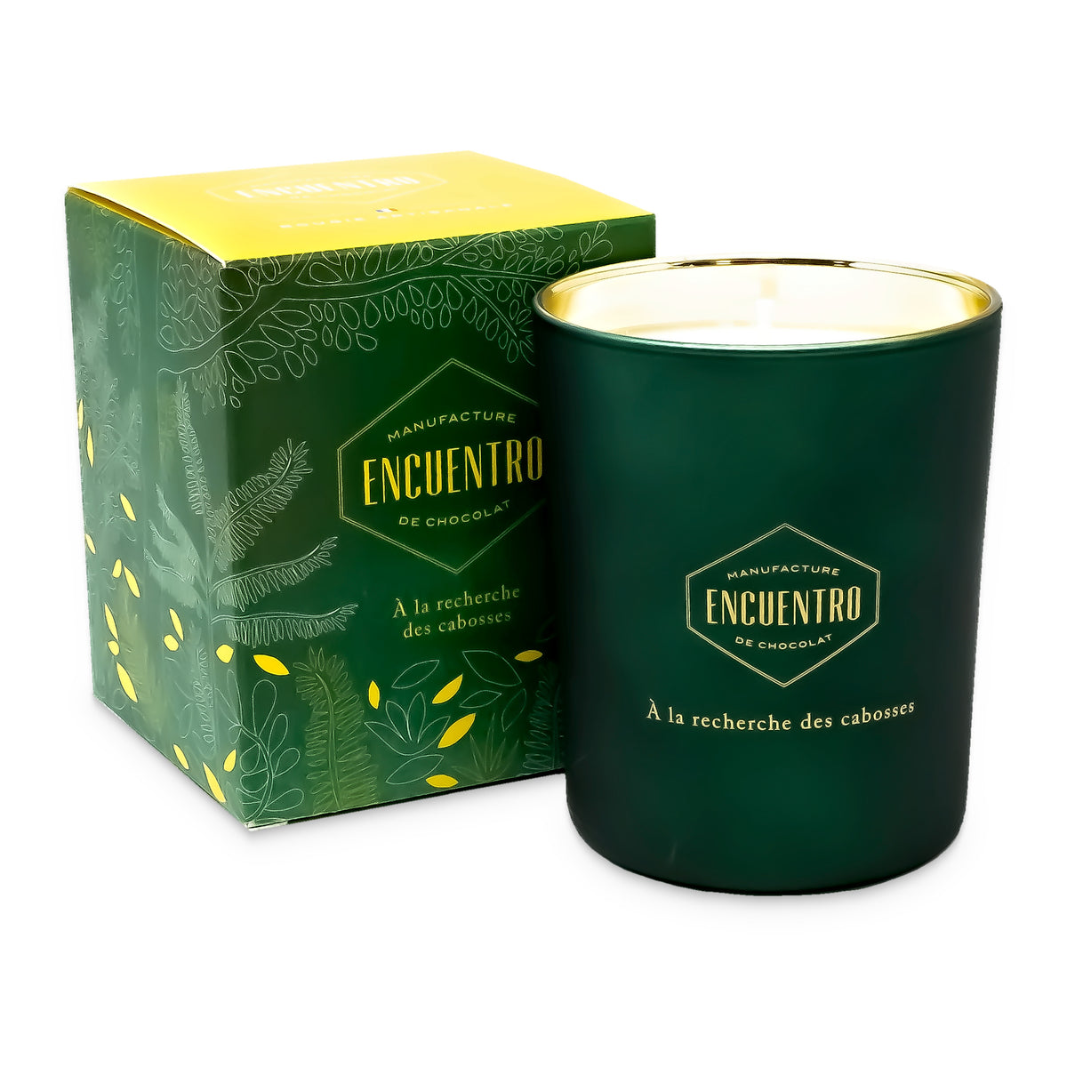 Artisanal Candle by Encuentro in a green glass jar, with its gift box
