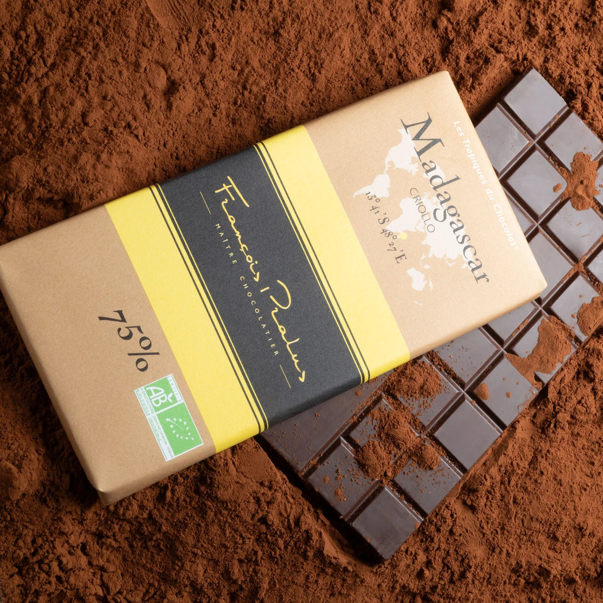 Madagascar 75% Dark Chocolate Bar by François Pralus on cocoa powder