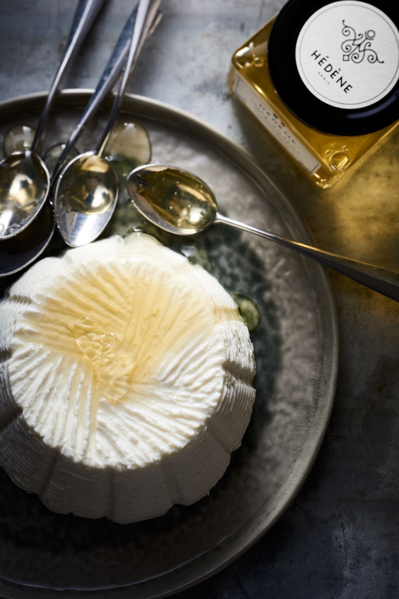 Hédène acacia honey with brocciu cheese and silver spoons