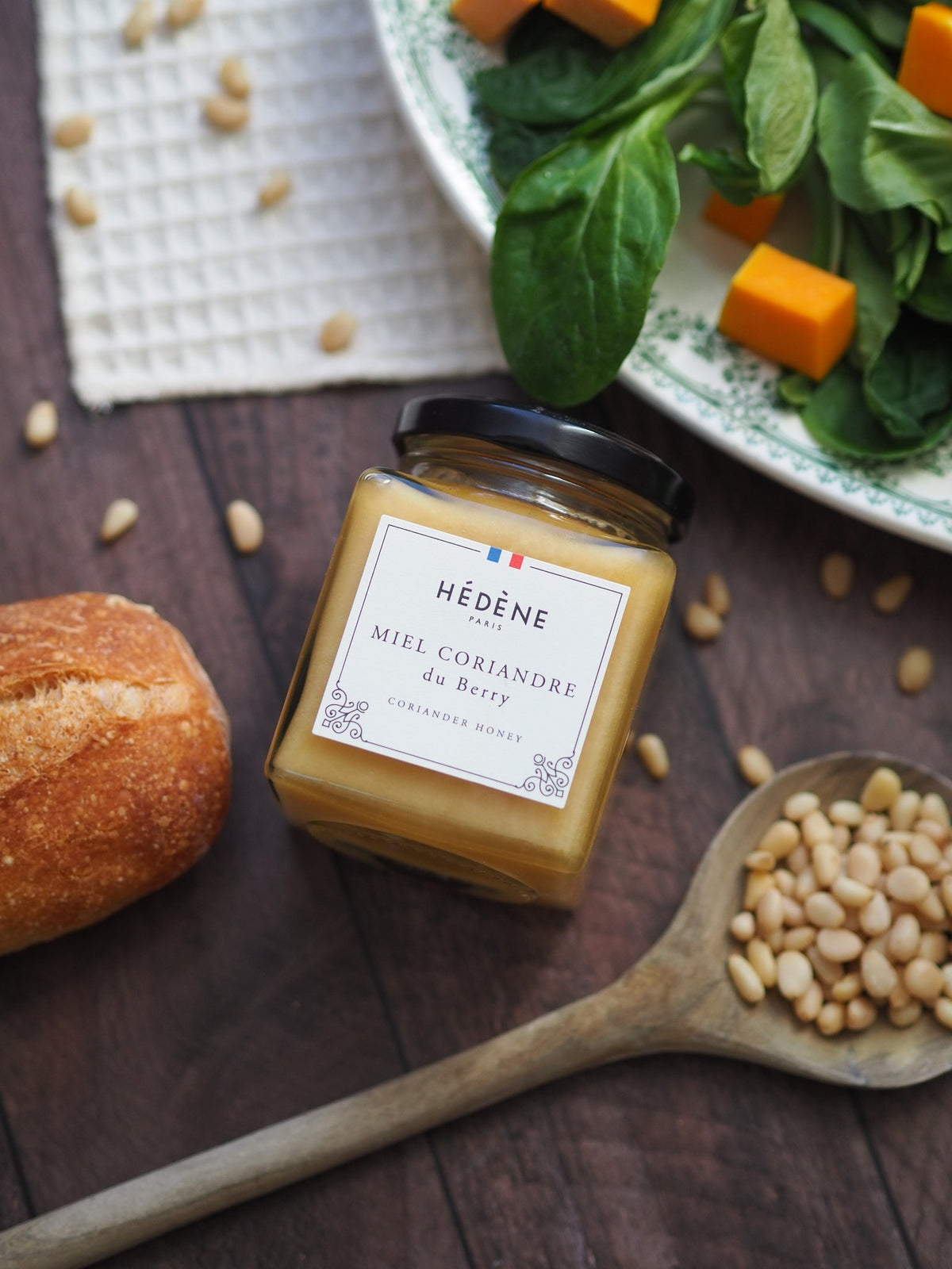 Hédène Berry coriander honey jar with pine nuts and fresh bread