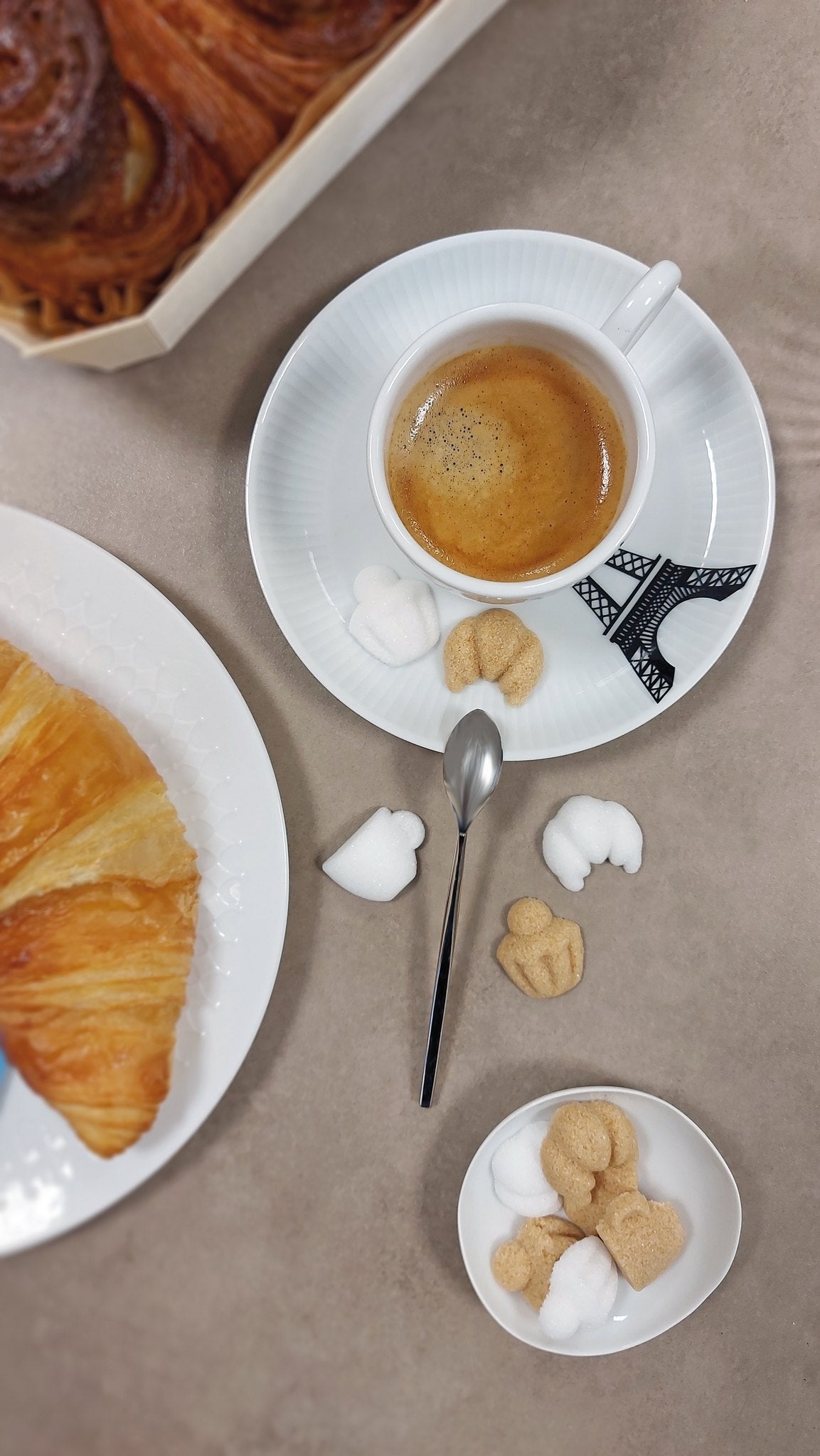 Canasuc Matin à Paris sugars with a croissant and espresso